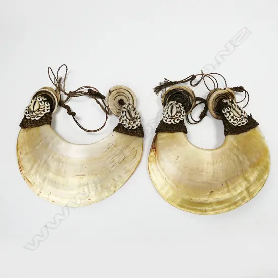 Two PNG kina shell breast plate ornaments,